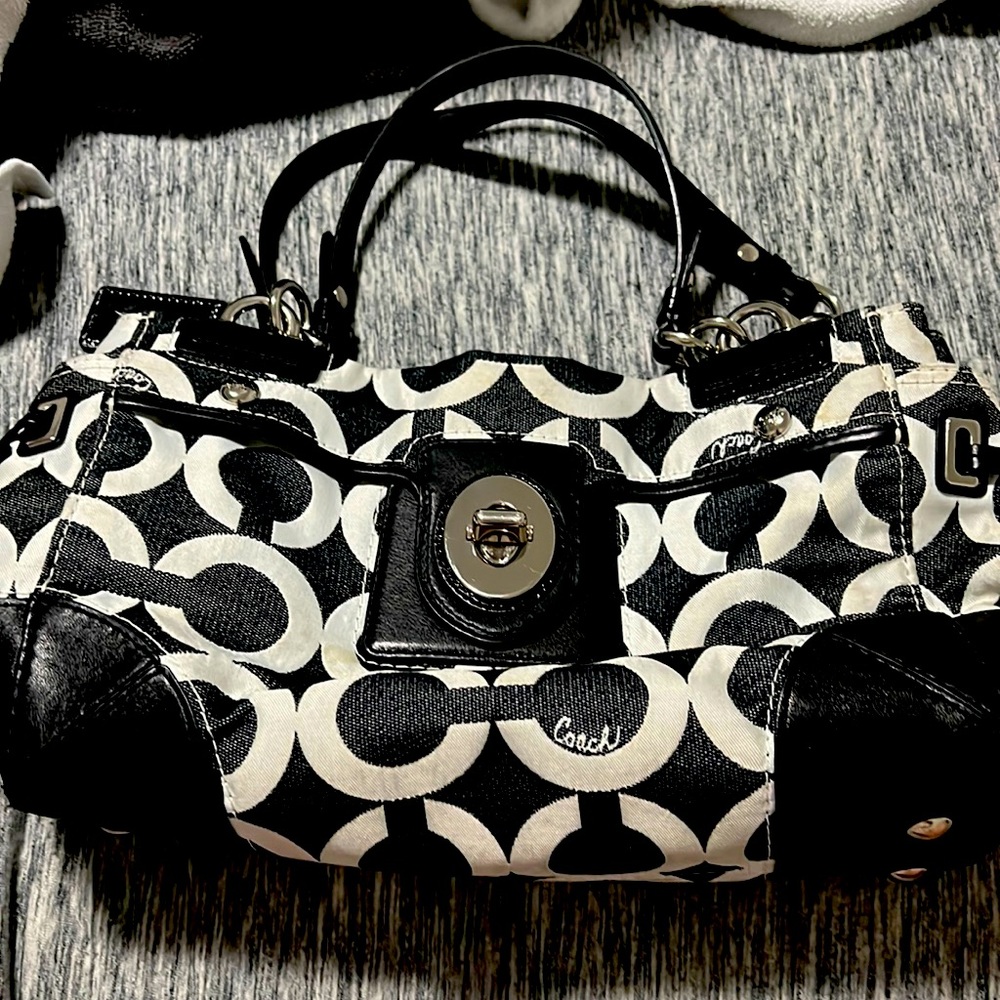 medium size handbag. Really comfortable on the shoulder. holds a lot